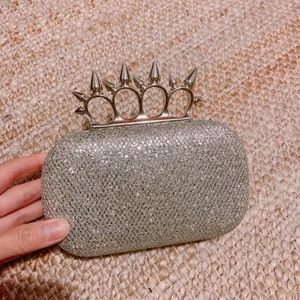 Sparkly silver clutch with spike hardware